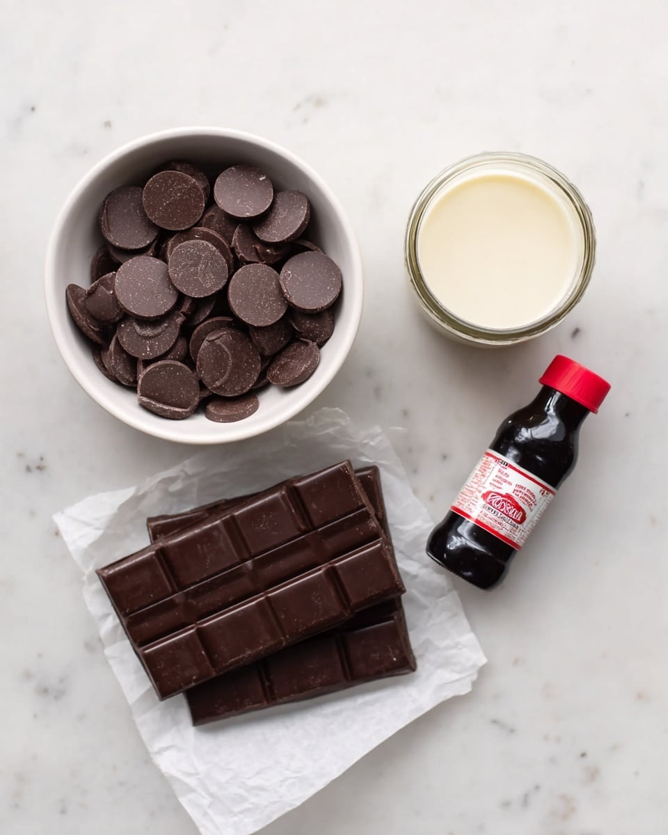 The image shows a white bowl filled with round, flat dark chocolate pieces on the left side. Below the bowl, there are two large, dark chocolate bars stacked on a piece of white parchment paper. Toward the top center is a small glass jar with light-colored cream or milk inside, viewed from above. To the right of the jar is a small dark bottle with a red cap and a white label, standing on a white marbled surface. photo taken with an iphone --ar 4:5 --v 7