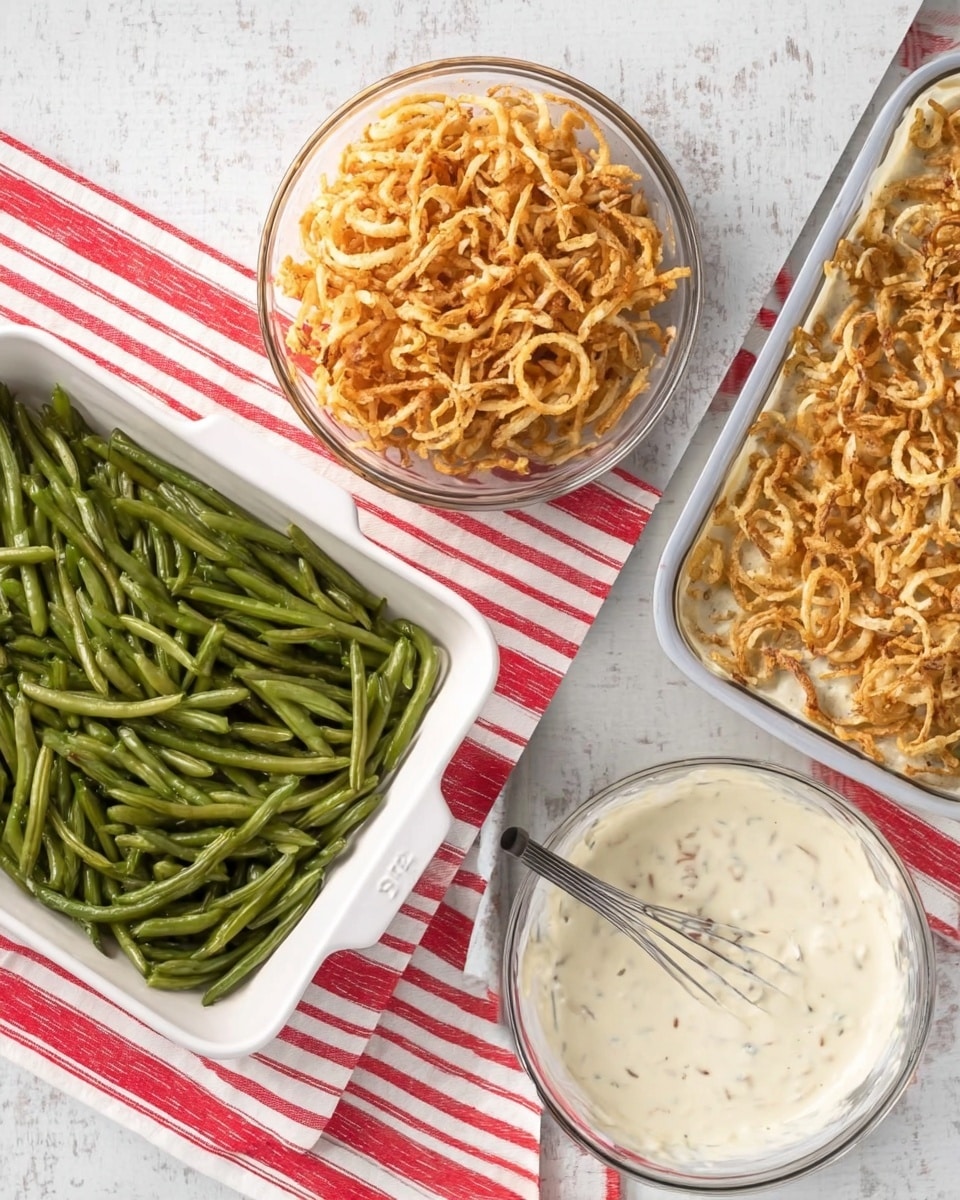 A white square baking dish is filled with a layer of green beans on the bottom, which are smooth and shiny. Next to it, a clear glass bowl holds crispy light brown onion rings, and a large clear glass bowl contains a creamy white sauce with flecks of seasoning, shown with a silver whisk resting inside. In the final image, the baking dish is topped with a thick white sauce layer evenly spread over the green beans, and a generous layer of the crispy onion rings is scattered on top, adding a crunchy texture. All items sit on a white marbled surface with a red and white striped cloth underneath. photo taken with an iphone --ar 4:5 --v 7