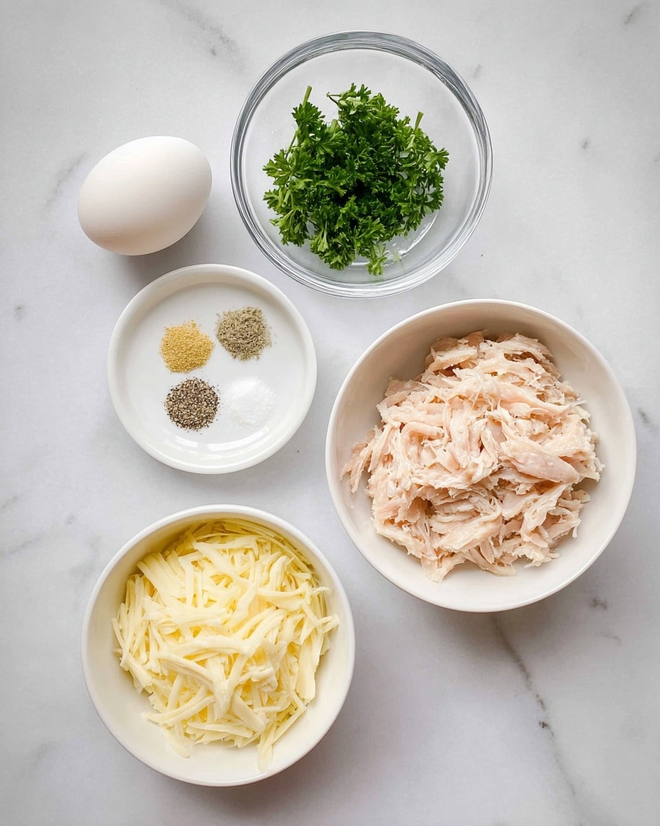 The image shows a white marbled surface with five items placed neatly. At the top right, there is a white bowl filled with shredded light pink chicken. Below it on the right is a white bowl filled with pale yellow shredded cheese. To the left of the cheese bowl, there is a clear glass bowl holding a small bunch of fresh green parsley. Above this bowl is a white ramekin with three spices: black pepper, white salt, and yellow garlic powder arranged in separate small piles. Finally, at the top left corner lies a single whole white egg. The setup looks clean and ready for cooking. photo taken with an iphone --ar 4:5 --v 7