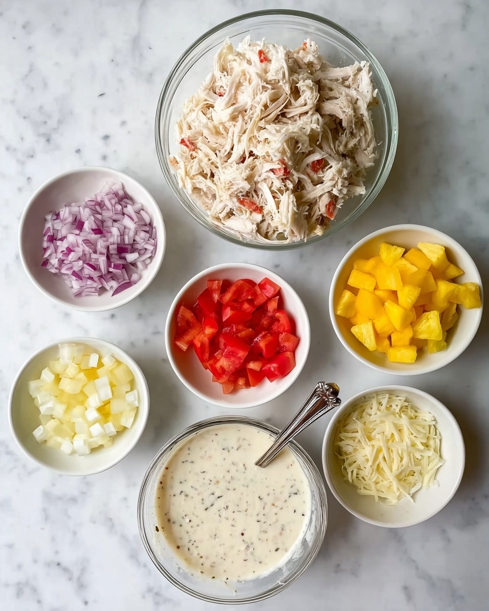 A top view of seven small white bowls arranged in a circle on a white marbled surface, with one larger clear bowl in the center. At the top center is a large bowl filled with shredded light beige chicken. Moving clockwise, the small bowls contain finely chopped purple onions, sliced pale yellow cheese sticks, small pieces of bright red pepperoni, chopped red tomatoes, bright yellow pineapple chunks, and white crumbly cheese. The large bowl at the bottom center holds a creamy white sauce with black specks, and a spoon stands inside it. photo taken with an iphone --ar 4:5 --v 7