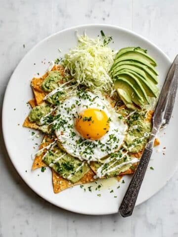 Green Salsa Verde Chilaquiles with Fried Eggs and Fresh Toppings Recipe