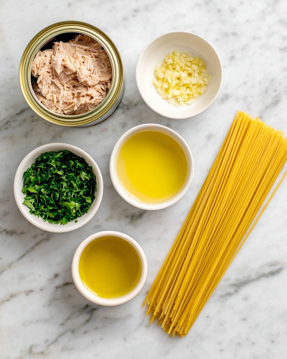 On a white marbled surface, there is a group of ingredients arranged neatly: an open can of light beige tuna with oil inside at the top left, a small white bowl of finely chopped light yellow garlic below it, a small white bowl filled with bright green chopped parsley at the bottom left, a small white bowl with light yellow lemon juice near the middle right, and a small yellow bowl filled with golden olive oil above it. To the far right, there is a bundle of uncooked light yellow spaghetti lying flat. Each ingredient has a clear label in black text above or beside it. photo taken with an iphone --ar 4:5 --v 7