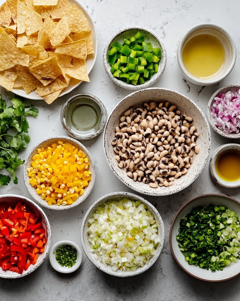 The image shows several small white bowls and a few other containers arranged on a white marbled surface, each filled with different colorful chopped ingredients. Starting from left to right, there are chopped yellow bell peppers in a speckled white bowl, chopped green bell peppers in a white bowl, chopped red bell peppers in a white bowl, and a bowl with a mix of yellow and white corn pieces. Next to them, a large bowl of black-eyed peas with cream and black spots is centered. Surrounding these are bowls with diced white squares that look like root vegetables, sliced green onions, finely chopped green chili peppers, crushed salt in a small round white bowl, and liquids in small clear or light ceramic cups, including oil and another golden-yellow liquid. On the far left, a white plate holds light tan crispy tortilla chips, with green fresh cilantro leaves next to it, and a woman's hand partially visible near the side. The overall colors are bright and fresh, with clean separation of each ingredient. Photo taken with an iphone --ar 4:5 --v 7