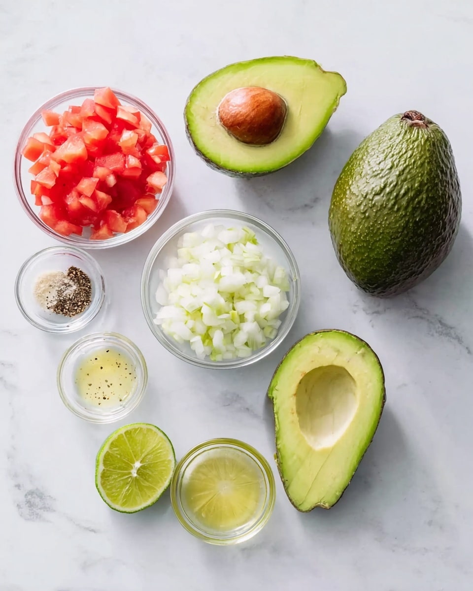The image shows ingredients for a fresh guacamole laid out on a white marbled surface: two halves of a ripe avocado, one with the pit still inside and the other empty, placed near a whole avocado; two small clear bowls with finely chopped white onion and diced red tomato, positioned above the avocados; two lime halves set beside the avocados; and three tiny clear bowls arranged to the left side of the limes containing minced garlic, black pepper, and a small amount of clear liquid, likely oil or lime juice. The overall look is clean and bright with natural colors of the ingredients clearly visible photo taken with an iphone --ar 4:5 --v 7