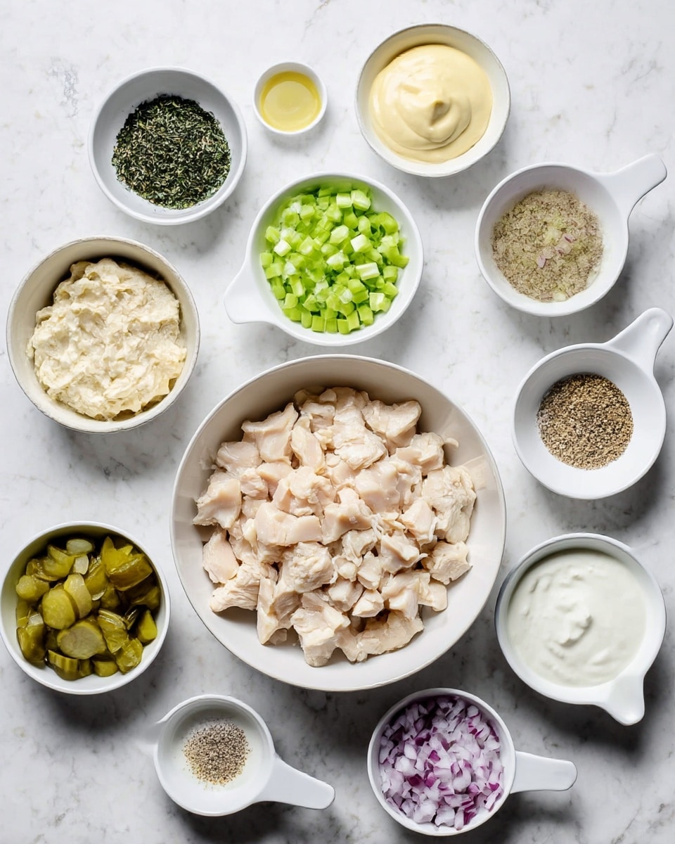 In the center, there is a white bowl filled with chopped light beige chicken pieces, surrounded by smaller white bowls and white measuring cups with different ingredients. Clockwise from the top, these include a small bowl of pale yellow mustard, a bowl of creamy light beige mayonnaise, a bowl of finely chopped dark green herbs, a ½ cup white measuring cup with bright green diced celery, a small bowl with light liquid and a few mustard seeds, a 1-cup white measuring cup filled with chopped green pickles, a small bowl with light beige powder, a ⅓ cup white measuring cup with white creamy yogurt, a small white bowl with coarse salt and black pepper mix, and finally a ¼ cup white measuring cup filled with finely chopped light purple onions. All items are set on a white marbled textured surface. Photo taken with an iphone --ar 4:5 --v 7