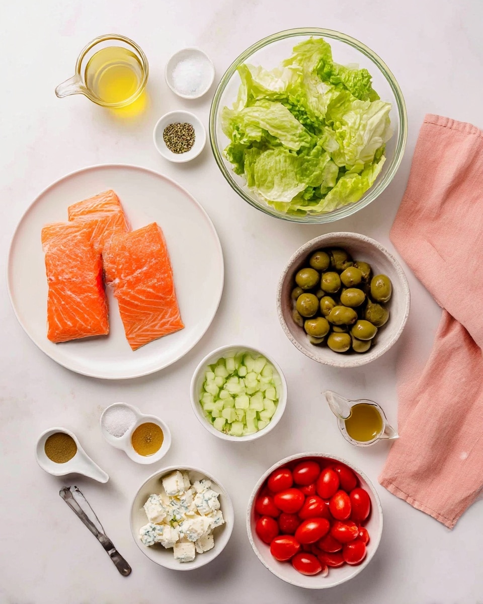 The image shows all the ingredients for a meal arranged neatly on a white marbled surface. At the center left, there is a white plate with two raw orange salmon fillets. To the top right, a clear glass bowl holds fresh green chopped lettuce. Below the lettuce, a small white bowl contains light green diced cucumber pieces. Next to it on the right, a white bowl is filled with bright red cherry tomatoes. Below the salmon plate to the left, a small white bowl is filled with white chunks of blue cheese. To its right, another white bowl holds green olives stuffed with red pimentos. Scattered around these main items are small white bowls with salt and pepper, a small measuring cup with amber olive oil, a small bowl with light yellow juice, a tablespoon with beige mustard, and another tablespoon with dried green herbs. A soft pink cloth napkin is on the bottom right. The photo was taken with an iphone --ar 4:5 --v 7