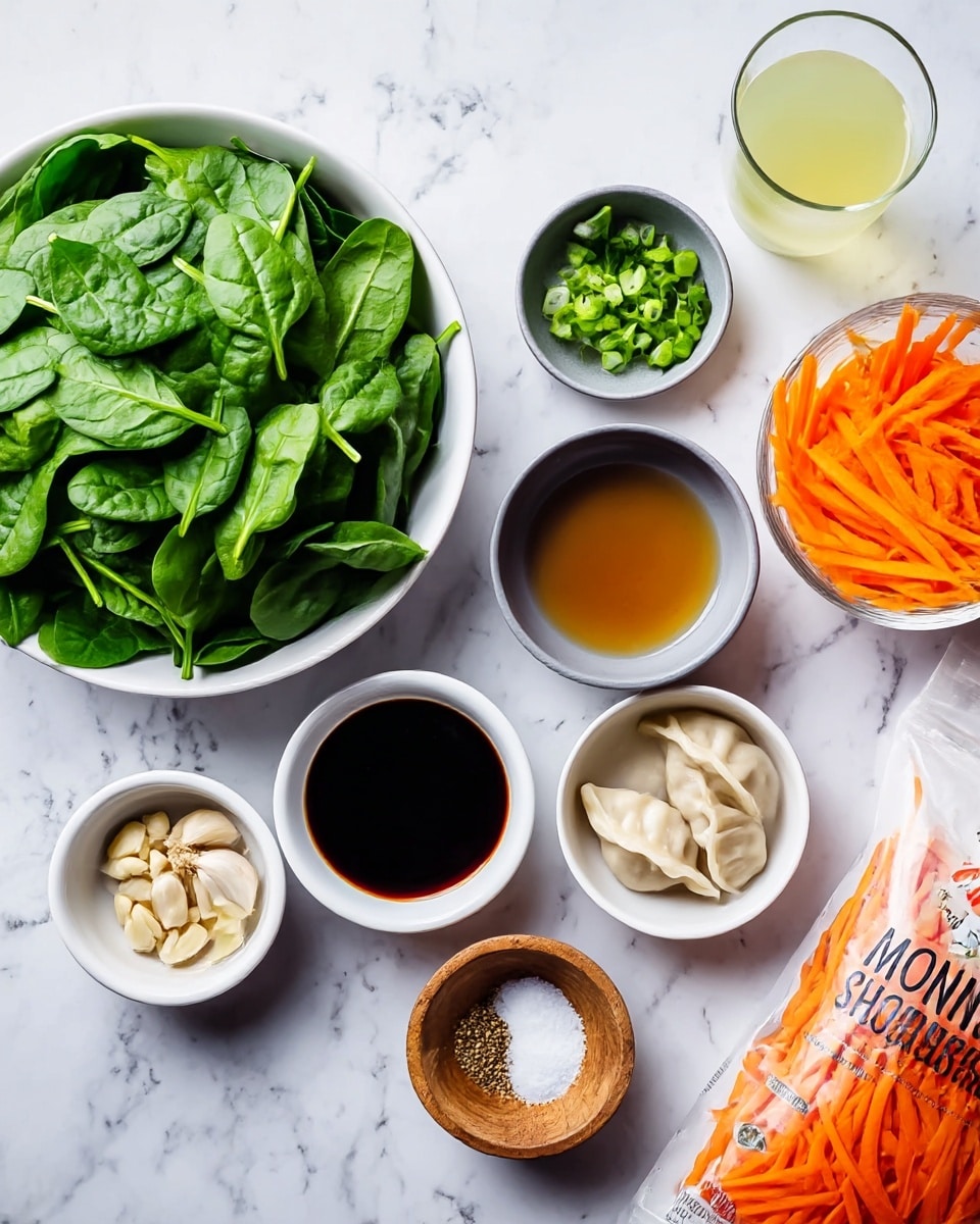 The image shows a white bowl filled with fresh green spinach leaves on the left. Around it are small white bowls holding light brown liquid, minced garlic, dark soy sauce, and chopped green onions, while a small gray bowl contains salt and a small wooden bowl holds minced garlic. A larger white bowl on the right holds thin, bright orange carrot strips. On the far right is a glass with a pale yellow liquid. A partially visible white package of Korean style mini wontons with chicken and vegetable dumplings lies on the surface. The whole setup is on a white marbled background and looks bright and fresh. photo taken with an iphone --ar 4:5 --v 7
