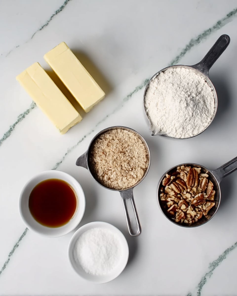 On a white marbled surface, there are five ingredients arranged: at the top center, two light yellow sticks of butter side by side; to the top right, a metal measuring cup filled with white flour; at the bottom right, a metal measuring cup with chopped brown nuts; at the bottom left, a small white bowl with white powdered sugar; next to it, on the left center, a small white bowl filled with brown vanilla extract. Photo taken with an iphone --ar 4:5 --v 7