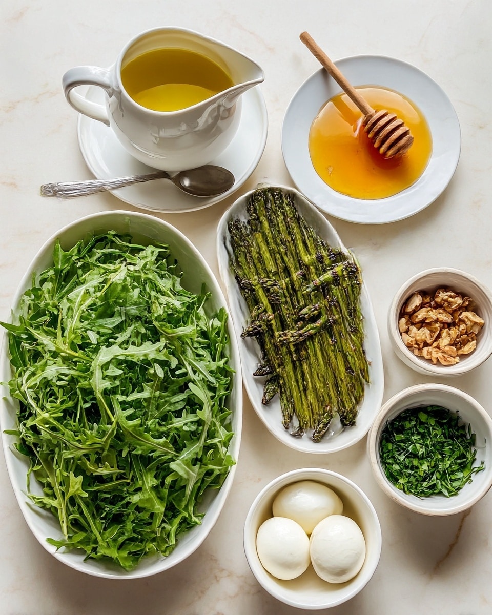 The image shows six containers with different ingredients placed on a white marbled surface. At the bottom left, a white bowl is filled with fresh green arugula leaves, showing their distinct jagged edges and varying shades of green. To the right of this bowl, there is an oval white plate with grilled asparagus spears that are bright green with slightly charred, darkened tips and texture. Above the arugula, a white pitcher contains golden olive oil with a silver spoon resting beside it on a matching white saucer. Next to it on the right, a small white bowl holds amber-colored honey with a wooden honey dipper resting inside. Below the honey bowl, a white round bowl contains two smooth white balls of fresh mozzarella cheese soaking in a pale liquid. At the top right, a small white bowl is filled with light brown chopped nuts, and next to it on the right is a tiny white bowl filled with chopped fresh green herbs. The composition is cozy and fresh, with bright natural light enhancing the colors photo taken with an iphone --ar 4:5 --v 7