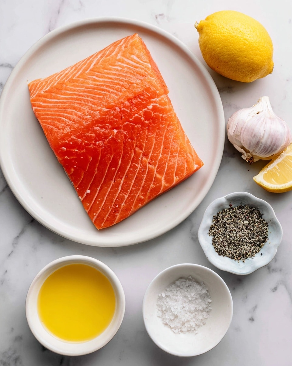 A large piece of bright orange salmon fillet with visible light lines of fat lying centered on a white plate, placed on a white marbled surface; around the plate, there is a small white bowl with melted yellow butter, a whole garlic bulb with light white and purple skin, a half lemon with bright yellow skin, and a small white bowl filled with coarse black and white salt and pepper mix. Photo taken with an iphone --ar 4:5 --v 7