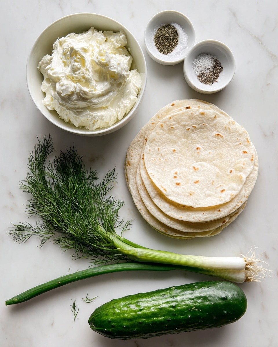 A white bowl holds soft, creamy, off-white cream cheese with smooth and slightly lumpy texture, next to a small white dish containing coarse salt and ground black pepper. To the right, a neat stack of several pale, slightly browned tortillas rests flat with visible folds and soft texture. Below them, a small bunch of fresh dill with fine green needle-like leaves is laid out, beside a bright green onion stalk with long white base and dark green tip. At the bottom, a whole cucumber with dark green, bumpy skin lies horizontally on a white marbled surface. The arrangement is clean and simple, emphasizing fresh and light ingredients, photo taken with an iphone --ar 4:5 --v 7
